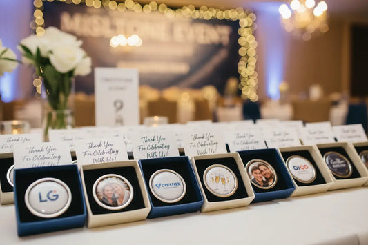 Elegant table display of custom party favors with personalized corporate logos and thank you cards for events