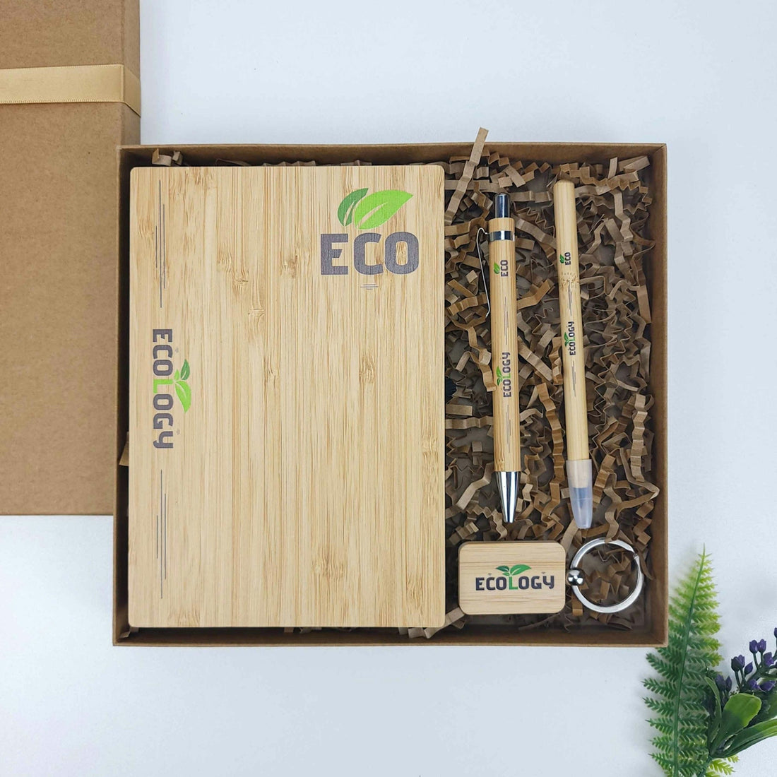 A wooden box with a bamboo keychain and a bamboo box with a bamboo