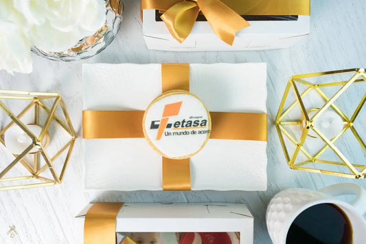 A table topped with boxes and a cup of coffee