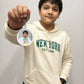 Child holding personalized photo keychain - Baggbay custom gift
